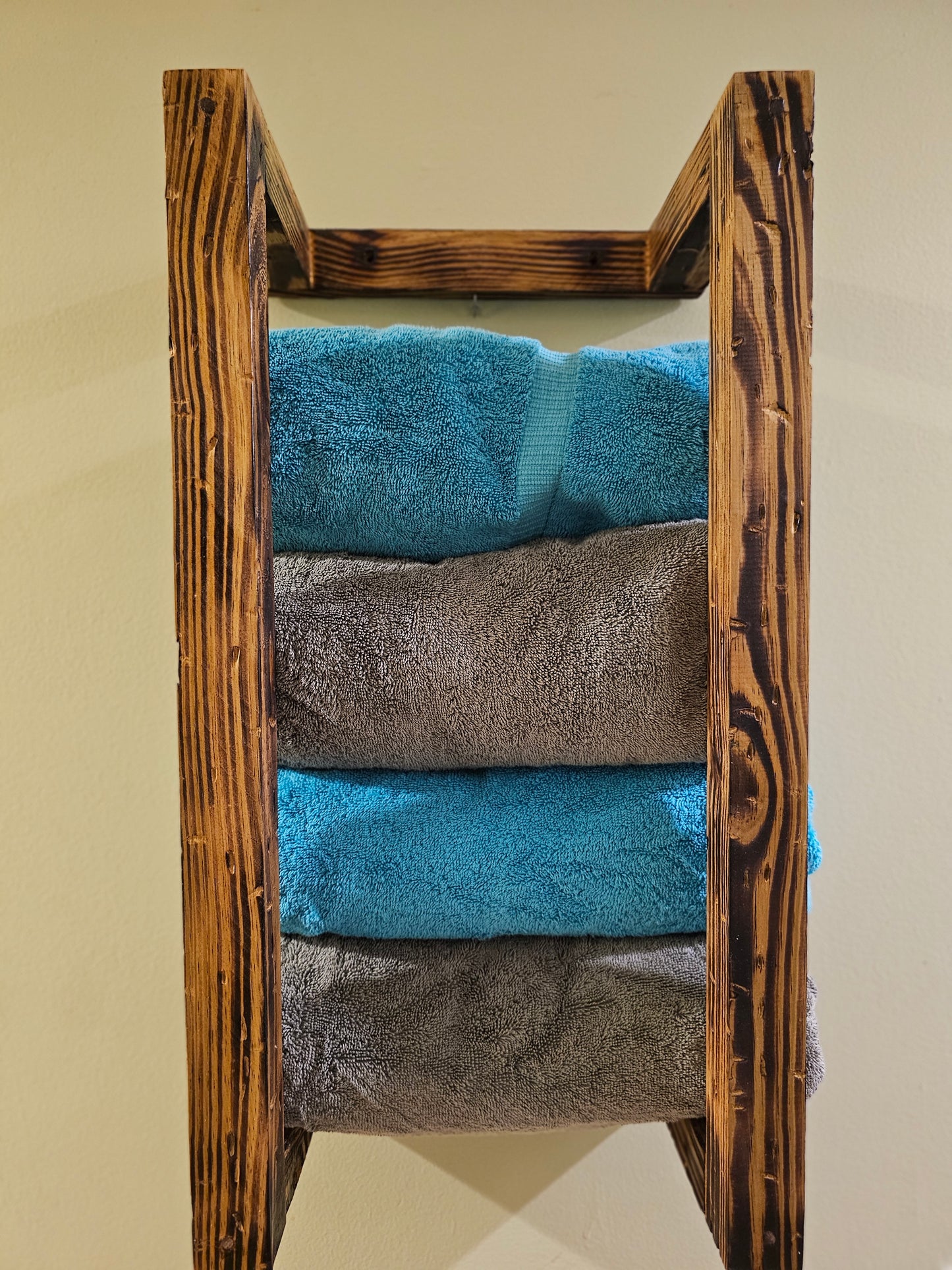 Rustic wall mount towel rack.