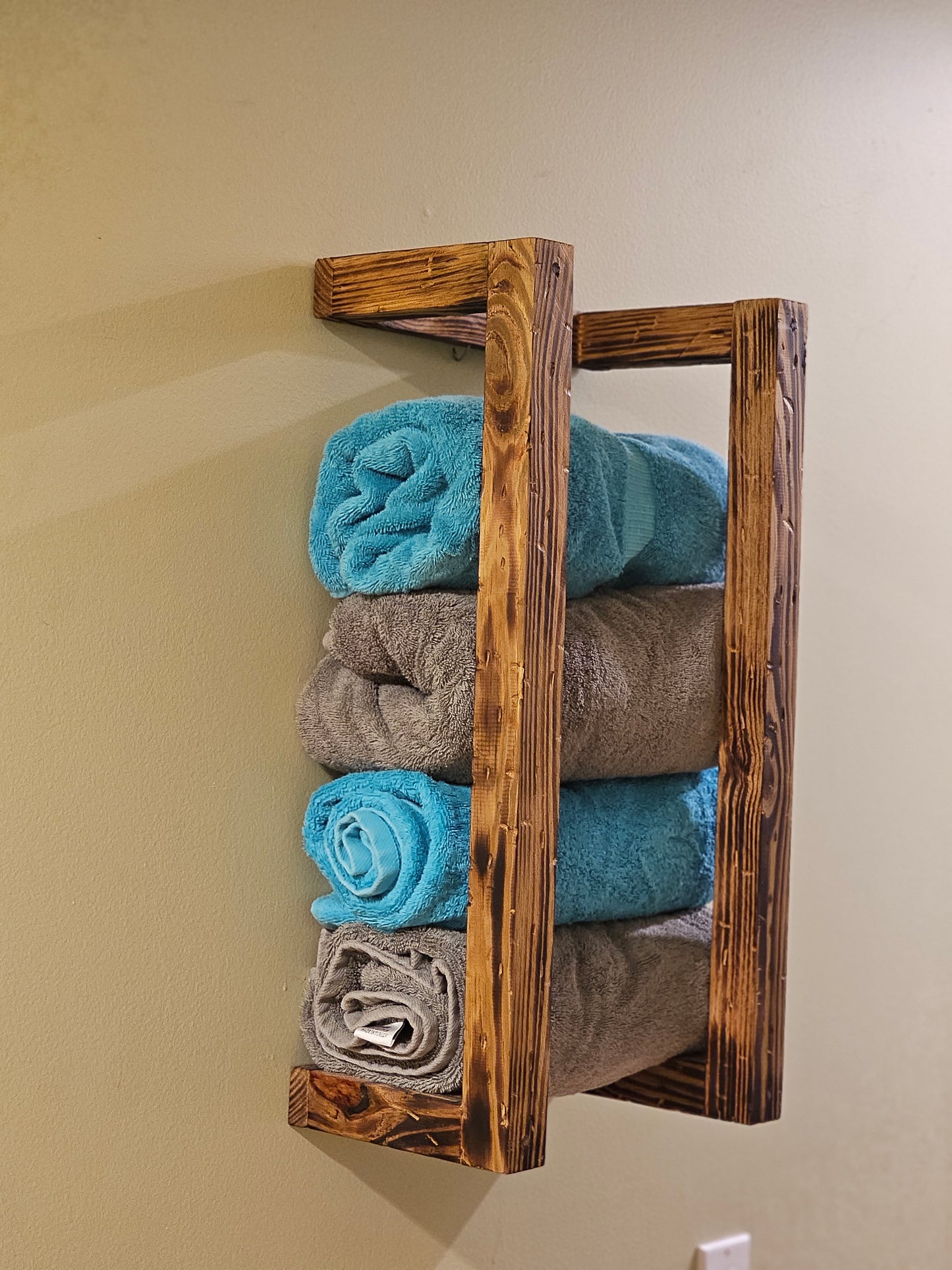 Rustic wall mount towel rack.